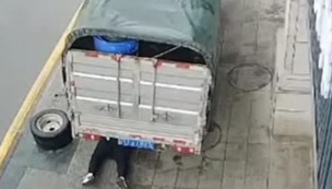 Repairman crashed under truck after the car jack slipped 