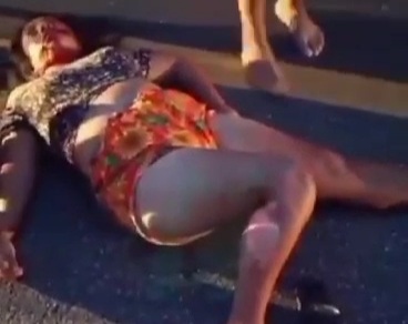 Female motorcyclist crashed dead by big truck 