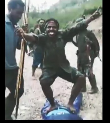 Rival factions in Ethiopia dance on top of their trophies