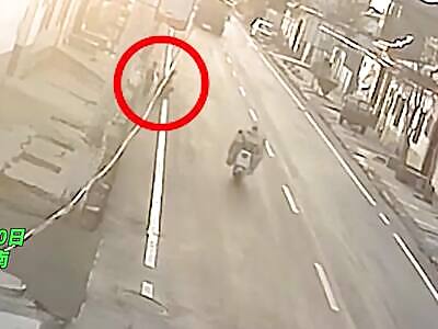  Kid plays frogger with a truck and loses.