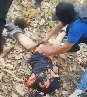 Hitmen Film Themselves Dismembering Body  