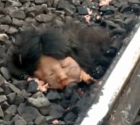 FACE OFF: Biker Loses Face to Train.