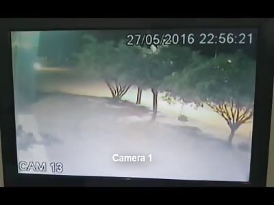 Guy Sitting in Front of a Shop Executed by Close Range Shots (2 Angles)