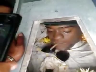 Smoking Dead Man in the Coffin