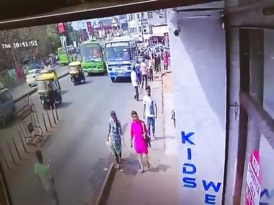 Man Distracted by Cellphone Knocked Down by Bus