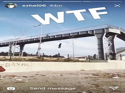 Man Hanging from a Bridge Live