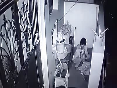 Crazy Man Smashing an Old Man's Head with Stone