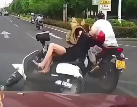 Stupid Girl on Moped......