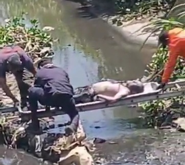 Male dead body floating in river 