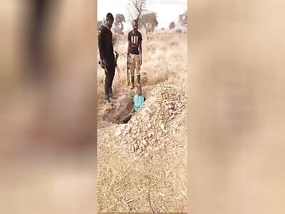 Man Laying In His Grave Gets Executed 