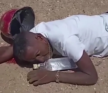 Drunk motorcyclist crashed hard and still protecting his bottle 