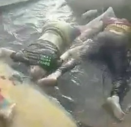 Sea thrown boat with three drowned man 