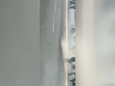 Motorcycle tiene burning by mob