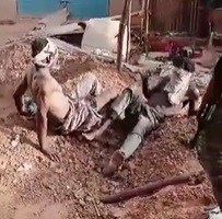 Two Men Executed in Self-dug Graves.