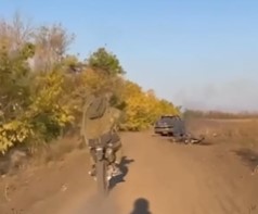 A Race For Life Or Death. Russian On Motorcycle Chased By RPG Carrying Drone