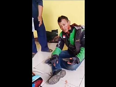 Thief being beaten by crowd