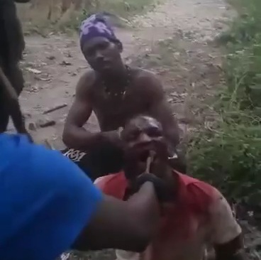 [HORROR]Haitian gang members pulling out teeth of rival with a pliers 