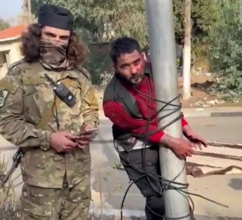 Syrian Regime soldier tied to pole and humiliated by rebels 