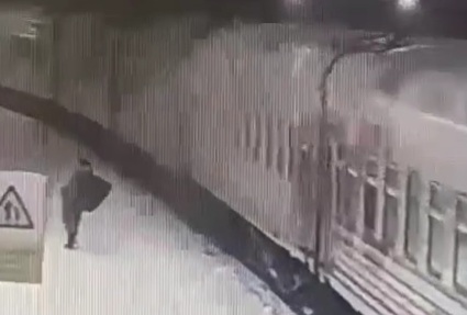 Drunk Dude Falls Under Moving Train