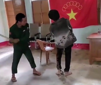 Chinese communist soldiers torturing young man