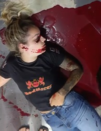 Blood Squirting Out Of Woman's Mouth After Getting Shot