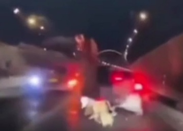 Motorcyclist crashed under big loaded truck 