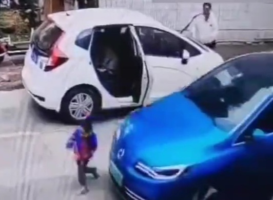 Chinese little kid run over by a car in front of his father 