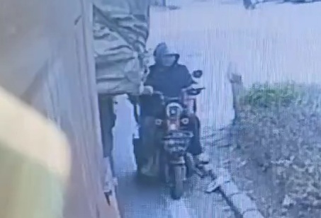 Stupid Chinese man on moped dragged and nearly crashed by loaded truck