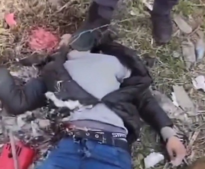 HTS members stomped a dead body of a ex-regime soldier 