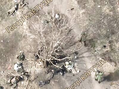 Dozens of rotting Russians lie on the road.