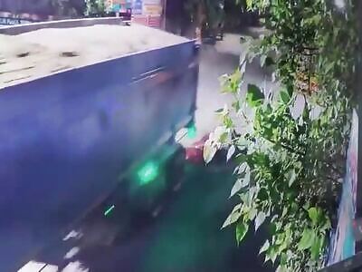 Cctv Captures Biker Getting Splattered By Truck