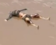 Drowned dead body floating in river 