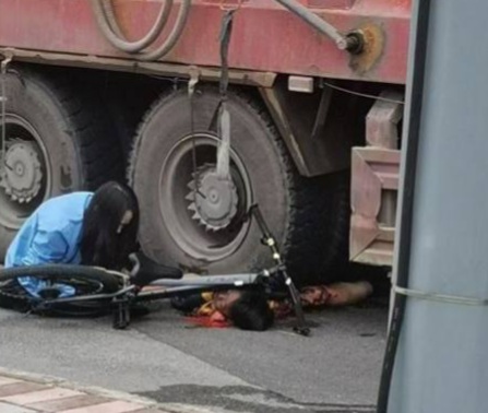 Cyclist Under Truck...