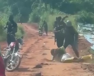 Cameroonian soldiers beating the shit out captured criminal 