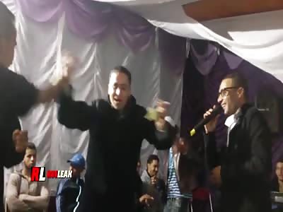 The guy at the wedding gets a cut on his face