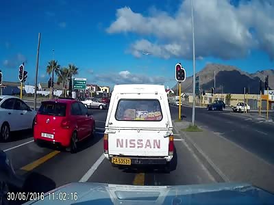 Two Thieves Steal from a Car at Stop Light