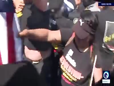  Chaos ensues as 'blood-soaked' US flag BURNS by protesters outside RNC