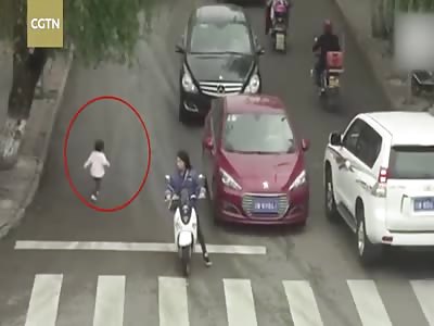 Footage: two-year-old girl run over by two cars only slightly injured