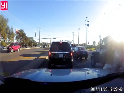 Elderly Woman Crashes into Car at Red Light