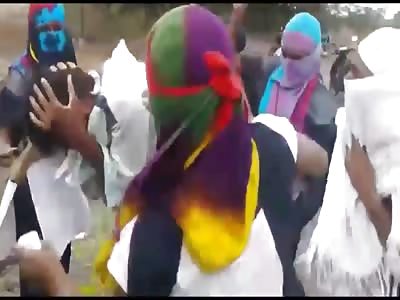  girls are beating boys with their slippers for eve teasing