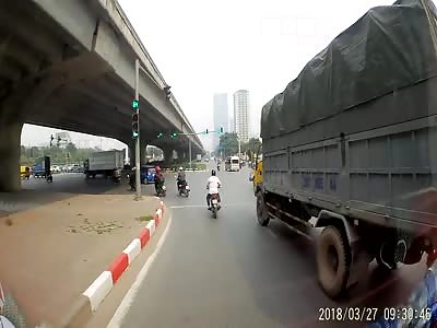 Biker Nearly Run Over by Truck 