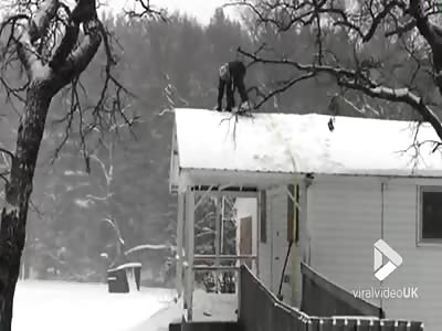 Snowboarding from roof goes wrong