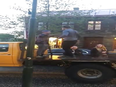 Guy Falls Off Back Of Truck