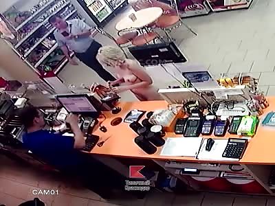 Naked girl buys a drink and condoms at the gas station store