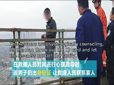 construction workers rescue suicidal man from jumping off building.