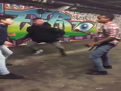 Two white guys beating up a black person