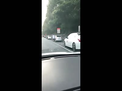 CASH GRAB! Drivers stop to collect cash that fell from armored truck