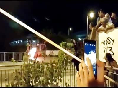 bull with horns on fire fall in the river