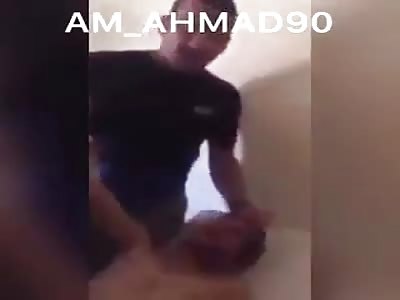 torturing injured Syrian in liban by group of shiite soldiers