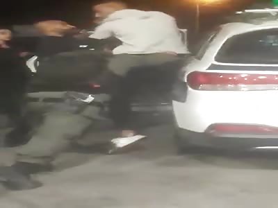 group of Israeli soldiers against one hard Palestinian